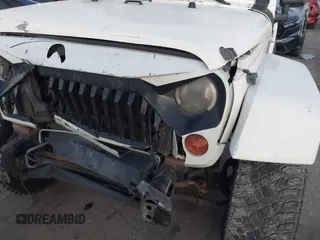 2010 Jeep Wrangler Unlimited Sahara with VIN 1J4BA5H15AL184376, listed as a IAAI auction lot 41270637 with 143,339 mi miles. Bid and sale history available at carsss.com. Image 6.