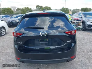 2018 Mazda CX-5 Grand Touring with VIN JM3KFBDM2J0390611, listed as a IAAI auction lot 42006482 with 97,497 mi miles. Bid and sale history available at carsss.com. Image 16.