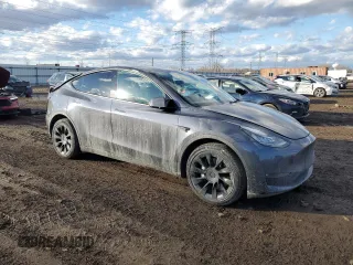 2022 Tesla Model Y Long Range with VIN 7SAYGDEE7NF386082, listed as a Copart auction lot 47191625 with 73,634 mi miles and Salvage Title. Bid and sale history available at carsss.com. Image 4.