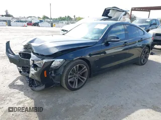2015 BMW 4 Series 428i z VIN WBA4A9C5XFD416873, wystawiony jako IAAI lot #42108645 z przebiegiem 93 433 mil mil oraz . Historia ofert i sprzedaży dostępna na DreamBid. Obrazek 2.