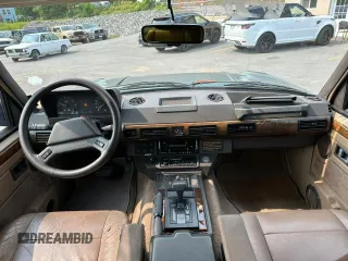 1990 Land Rover Range Rover z VIN SALHV1249LA408661, wystawiony jako Copart lot #59861925 z przebiegiem 129 140 mil mil oraz Czysty tytuł • Clean title. Historia ofert i sprzedaży dostępna na DreamBid. Obrazek 8.
