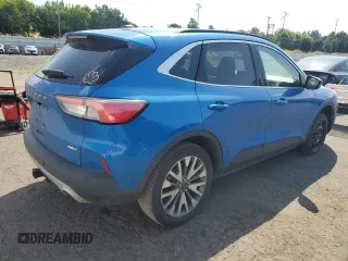 2020 Ford Escape Titanium z VIN 1FMCU9J90LUB15564, wystawiony jako Copart lot #59673625 z przebiegiem 84 474 mil mil oraz Czysty tytuł • Clean title. Historia ofert i sprzedaży dostępna na DreamBid. Obrazek 3.