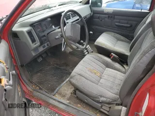 1989 Nissan Hardbody E z VIN 1N6ND16Y9KC352795, wystawiony jako Copart lot #72202814 z przebiegiem 242 396 mil mil oraz Tytuł czysty. Historia ofert i sprzedaży dostępna na DreamBid. Obrazek 8.