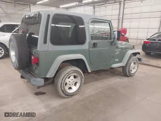 1999 Jeep Wrangler Sport with VIN 1J4FY19S0XP496555, listed as a IAAI auction lot 42110414 with 125,500 mi miles. Bid and sale history available at carsss.com. Image 4.