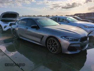 2023 BMW 8 Series M850i with VIN WBAGV8C02PCL20503, listed as a Copart auction lot 74098614 with Not Provided miles and Salvage Title. Bid and sale history available at carsss.com. Image 4.