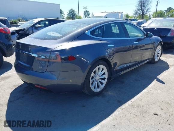 2017 Tesla Model S 100D with VIN 5YJSA1E20HF198503, listed as a IAAI auction lot 41843782 with 77,281 mi miles and . Bid and sale history available at DreamBid. Image 4.