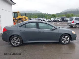 2009 Pontiac G6 1SB z VIN 1G2ZJ57B494247783, wystawiony jako IAAI lot #42309071 z przebiegiem 124 865 mil mil oraz . Historia ofert i sprzedaży dostępna na DreamBid. Obrazek 13.