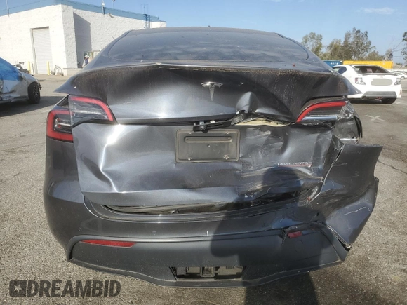 2022 Tesla Model Y Performance with VIN 7SAYGDEF3NF490643, listed as a Copart auction lot 46975825 with 50,792 mi miles and Salvage Title. Bid and sale history available at DreamBid. Image 6.