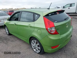 2013 Hyundai Accent SE with VIN KMHCU5AEXDU069586, listed as a IAAI auction lot 40968974 with 98,939 mi miles. Bid and sale history available at carsss.com. Image 3.