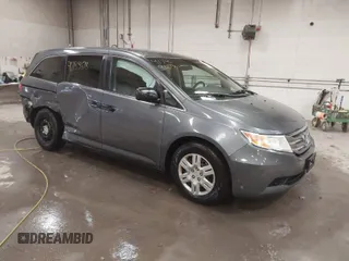 2012 Honda Odyssey LX with VIN 5FNRL5H29CB019931, listed as a IAAI auction lot 41733678 with 154,497 mi miles and . Bid and sale history available at carsss.com. Image 1.