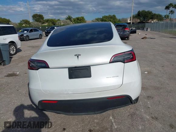 2023 Tesla Model Y Long Range z VIN 7SAYGDEE0PA128888, wystawiony jako IAAI lot #41410085 z przebiegiem 12 578 mil mil oraz . Historia ofert i sprzedaży dostępna na DreamBid. Obrazek 16.