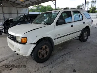 1999 Isuzu Rodeo S с VIN 4S2CK58W9X4383134, выставлен на аукционе Copart как лот 57351354 с пробегом 241 856 миль миль и Списание • Salvage title. История ставок и продаж доступна на DreamBid. Изображение 1.