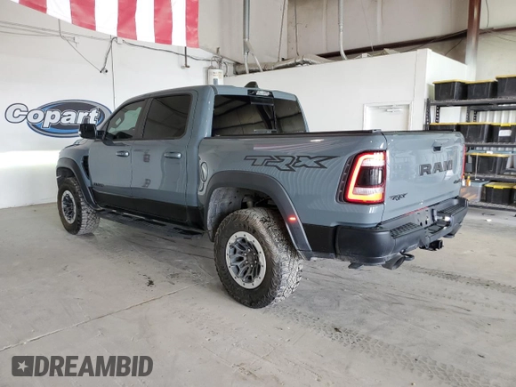 2021 Ram 1500 with VIN 0K1905786880, listed as a Copart auction lot 61756114 with 34,927 mi miles and Clean title. Bid and sale history available at DreamBid. Image 2.