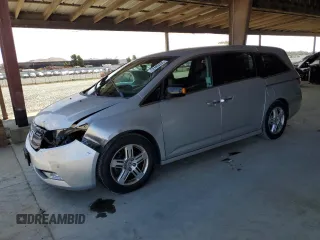 2012 Honda Odyssey Touring z VIN 5FNRL5H94CB111199, wystawiony jako Copart lot #62405905 z przebiegiem 145 260 mil mil oraz Szkoda całkowita • Salvage title. Historia ofert i sprzedaży dostępna na DreamBid. Obrazek 1.