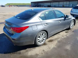 2014 Infiniti Q50 with VIN JN1BV7AP0EM682444, listed as a IAAI auction lot 41857312 with 140,765 mi miles. Bid and sale history available at carsss.com. Image 4.