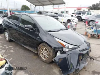 2019 Toyota Prius L Eco z VIN JTDKARFU6K3074058, wystawiony jako IAAI lot #41741499 z przebiegiem 70 834 mil mil oraz . Historia ofert i sprzedaży dostępna na DreamBid. Obrazek 1.