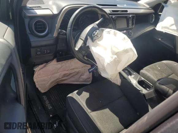 2018 Toyota RAV4 XLE with VIN 2T3WFREV7JW470850, listed as a Copart auction lot 49522265 with 102,029 mi miles and Salvage Title. Bid and sale history available at carsss.com. Image 8.