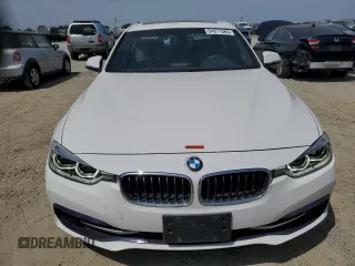 2018 BMW 3 Series 330i xDrive with VIN WBA8D9G56JNU71570, listed as a Copart auction lot 54071565 with 73,305 mi miles and Salvage title. Bid and sale history available at DreamBid. Image 5.