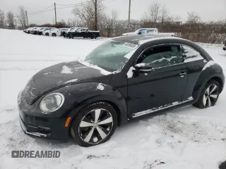 2012 Volkswagen Beetle 2.5L with VIN 3VWJX7AT9CM612892, listed as a Copart auction lot 48059405 with 106,416 mi miles and Salvage Title. Bid and sale history available at carsss.com. Image 1.