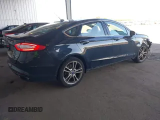 2014 Ford Fusion Titanium with VIN 3FA6P0K97ER328482, listed as a IAAI auction lot 40252350 with 137,128 mi miles. Bid and sale history available at carsss.com. Image 4.