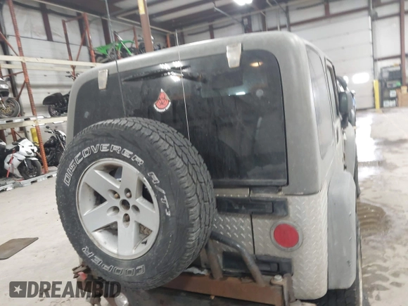 2005 Jeep Wrangler Rubicon with VIN 1J4FA69S65P311732, listed as a IAAI auction lot 41442147 with 174,277 mi miles. Bid and sale history available at carsss.com. Image 16.