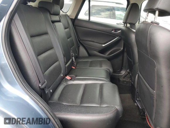 2016 Mazda CX-5 Grand Touring z VIN JM3KE4DY2G0637779, wystawiony jako Copart lot #52001805 z przebiegiem 184 381 mil mil oraz Czysty tytuł • Clean title. Historia ofert i sprzedaży dostępna na DreamBid. Obrazek 11.
