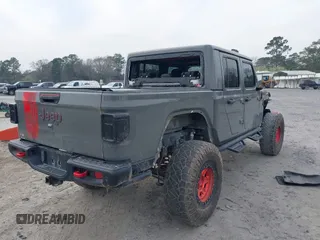2021 Jeep Gladiator Rubicon with VIN 1C6JJTBG7ML554354, listed as a IAAI auction lot 41796943 with 61,513 mi miles and . Bid and sale history available at DreamBid. Image 4.