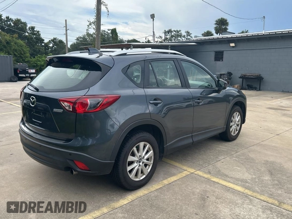 2013 Mazda CX-5 Sport with VIN JM3KE4BE7D0141588, listed as a Copart auction lot 66138585 with 124,920 mi miles and Clean title. Bid and sale history available at DreamBid. Image 4.