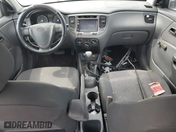 2009 Kia Rio LX with VIN KNADE223996526222, listed as a Copart auction lot 69976484 with 318,702 mi miles and Salvage Title. Bid and sale history available at DreamBid. Image 8.