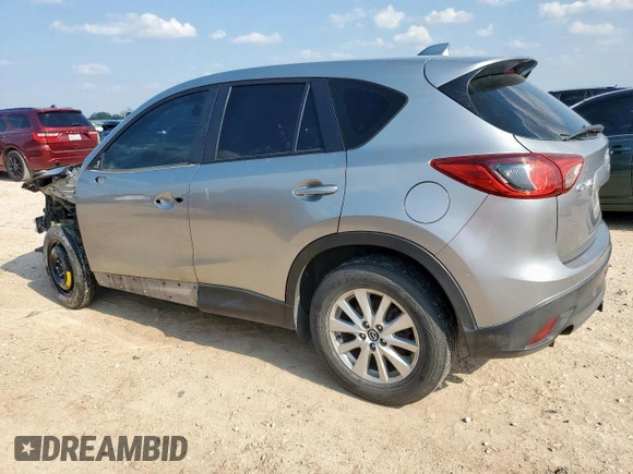 2013 Mazda CX-5 Sport with VIN JM3KE2BE5D0129797, listed as a Copart auction lot 58051185 with 200,712 mi miles and Salvage title. Bid and sale history available at DreamBid. Image 2.