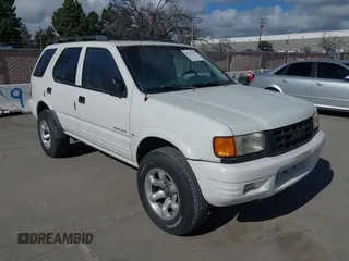 1998 Isuzu Rodeo S z VIN 4S2CK58W4W4308419, wystawiony jako IAAI lot #41711274 z przebiegiem 128 853 mil mil oraz . Historia ofert i sprzedaży dostępna na DreamBid. Obrazek 6.