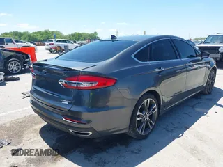 2020 Ford Fusion Titanium with VIN 3FA6P0K96LR173971, listed as a IAAI auction lot 42232469 with 82,474 mi miles and . Bid and sale history available at DreamBid. Image 4.