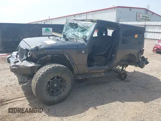 2014 Jeep Wrangler Sport with VIN 1C4AJWAGXEL233647, listed as a IAAI auction lot 39993785 with Not Provided miles and . Bid and sale history available at DreamBid. Image 2.