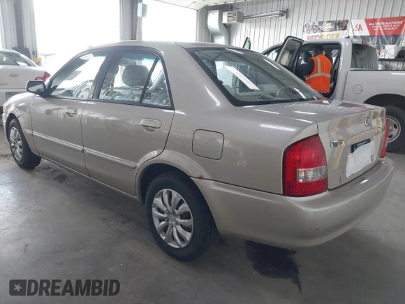 2000 Mazda Protege DX with VIN JM1BJ2221Y0239987, listed as a IAAI auction lot 42092488 with 140,756 mi miles and . Bid and sale history available at DreamBid. Image 3.