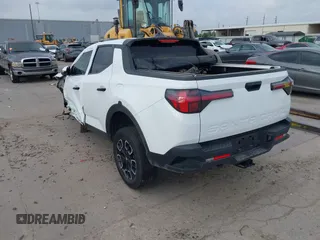 2022 Hyundai Santa Cruz SEL z VIN 5NTJBDAE5NH007005, wystawiony jako IAAI lot #42058065 z przebiegiem 30 825 mil mil oraz . Historia ofert i sprzedaży dostępna na DreamBid. Obrazek 3.