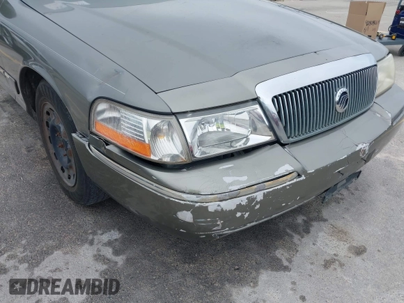 2003 Mercury Grand Marquis GS Convenience z VIN 2MEFM74W83X678151, wystawiony jako IAAI lot #42393410 z przebiegiem 273 966 mil mil oraz . Historia ofert i sprzedaży dostępna na DreamBid. Obrazek 14.