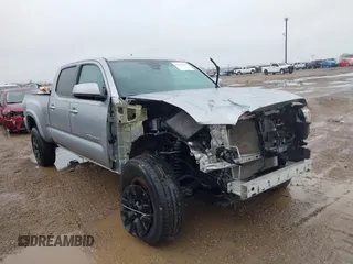 2019 Toyota Tacoma SR5 with VIN 5TFBZ5DN8KX004597, listed as a IAAI auction lot 41286419 with 80,896 mi miles and . Bid and sale history available at DreamBid. Image 1.