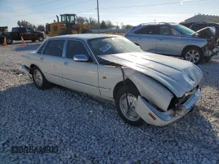 1995 Jaguar XJ with VIN SAJKX1745SC739290, listed as a Copart auction lot 82887524 with Not provided miles and Salvage title. Bid and sale history available at DreamBid. Image 4.