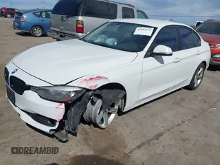 2015 BMW 3 Series 328i with VIN WBA3A5G51FNS89956, listed as a IAAI auction lot 42012575 with 121,246 mi miles. Bid and sale history available at carsss.com. Image 2.