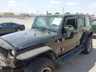 2013 Jeep Wrangler Unlimited Sport with VIN 1C4BJWDG9DL569109, listed as a IAAI auction lot 42115703 with 120,803 mi miles. Bid and sale history available at carsss.com. Image 6.