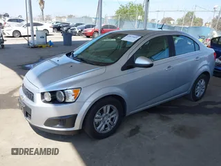 2013 Chevrolet Sonic LT with VIN 1G1JC5SB2D4243632, listed as a IAAI auction lot 42072421 with 40,289 mi miles and . Bid and sale history available at DreamBid. Image 2.