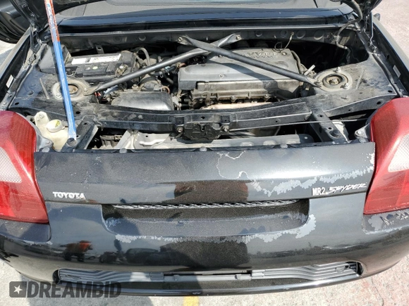 2000 Toyota MR2 z VIN JTDFR3200Y0006035, wystawiony jako Copart lot #56325275 z przebiegiem 143 879 mil mil oraz Szkoda całkowita • Salvage title. Historia ofert i sprzedaży dostępna na DreamBid. Obrazek 11.
