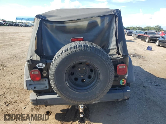 2002 Jeep Wrangler X with VIN 1J4FA39S12P732459, listed as a Copart auction lot 68877244 with 167,368 mi miles and Salvage Title. Bid and sale history available at carsss.com. Image 6.