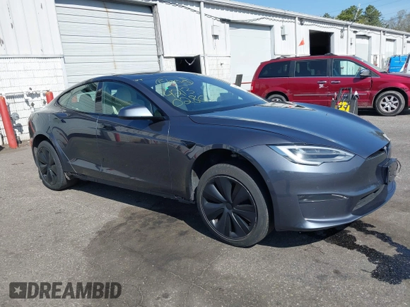 2021 Tesla Model S Plaid with VIN 5YJSA1E66MF456357, listed as a IAAI auction lot 42130286 with 48,010 mi miles. Bid and sale history available at carsss.com. Image 1.