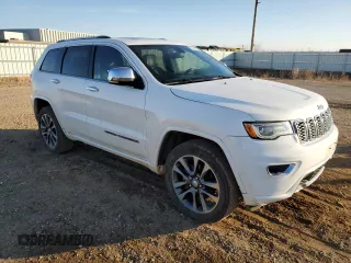 2017 Jeep Grand Cherokee Overland with VIN 1C4RJFCG3HC675125, listed as a Copart auction lot 50142865 with 113,819 mi miles and Salvage Title. Bid and sale history available at carsss.com. Image 4.