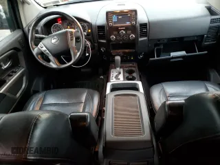 2015 Nissan Titan Pro-4X with VIN 1N6AA0EC2FN501632, listed as a Copart auction lot 84063524 with 92,342 mi miles and Salvage title. Bid and sale history available at DreamBid. Image 8.