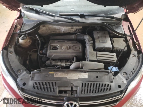 2013 Volkswagen Tiguan SE z VIN WVGBV3AX8DW092397, wystawiony jako Copart lot #51956225 z przebiegiem 138 901 mil mil oraz Szkoda całkowita • Salvage title. Historia ofert i sprzedaży dostępna na DreamBid. Obrazek 11.