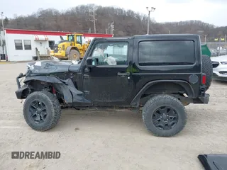 2014 Jeep Wrangler Sahara with VIN 1C4AJWBG9EL311477, listed as a IAAI auction lot 41884255 with 82,221 mi miles and . Bid and sale history available at carsss.com. Image 15.