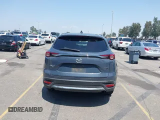 2022 Mazda CX-9 Grand Touring with VIN JM3TCBDY1N0611766, listed as a IAAI auction lot 42452059 with 60,755 mi miles and . Bid and sale history available at DreamBid. Image 16.