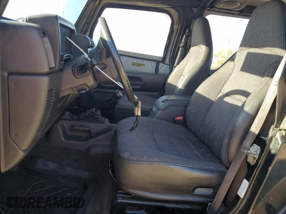 2002 Jeep Wrangler SE with VIN 1J4FA29P22P764181, listed as a Copart auction lot 76469364 with 134,275 mi miles and Salvage Title. Bid and sale history available at DreamBid. Image 7.